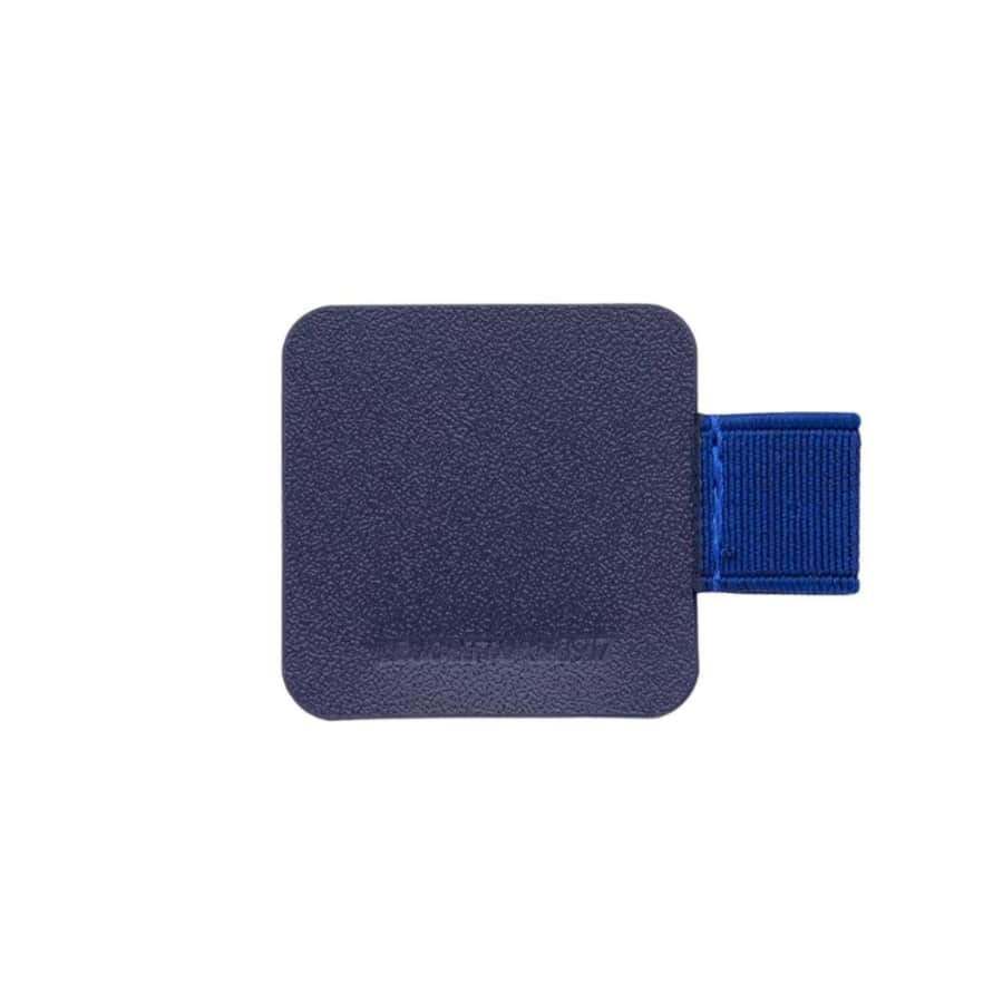 Leuchtturm1917 pen loop attached to a notebook, holding a black ink pen, designed for secure attachment and easy access.