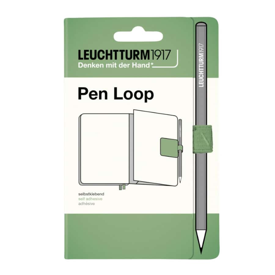 Leuchtturm1917 Pen Loop in black attached to a notebook, designed to hold a pen securely on the cover.