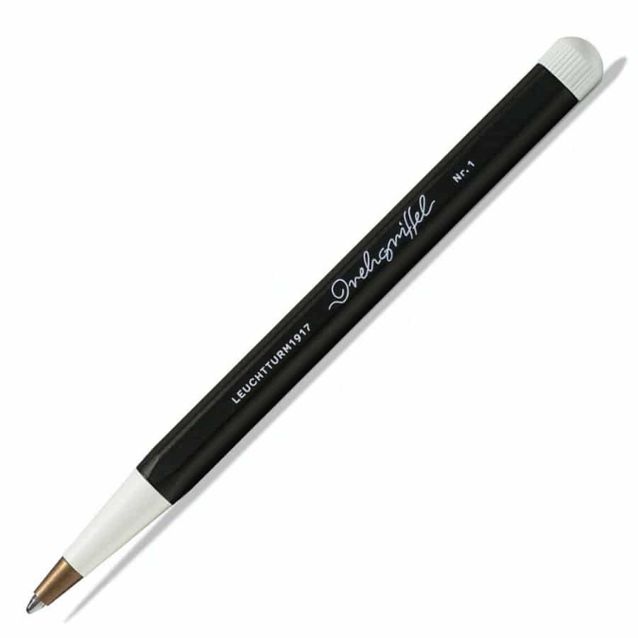 Leuchtturm1917 ballpoint pen with royal blue ink and sleek black design, positioned on a white background.