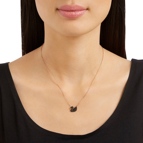 Small Swarovski Swan Pendant in black with rose gold-tone plating, featuring a detailed swan design on a delicate chain.