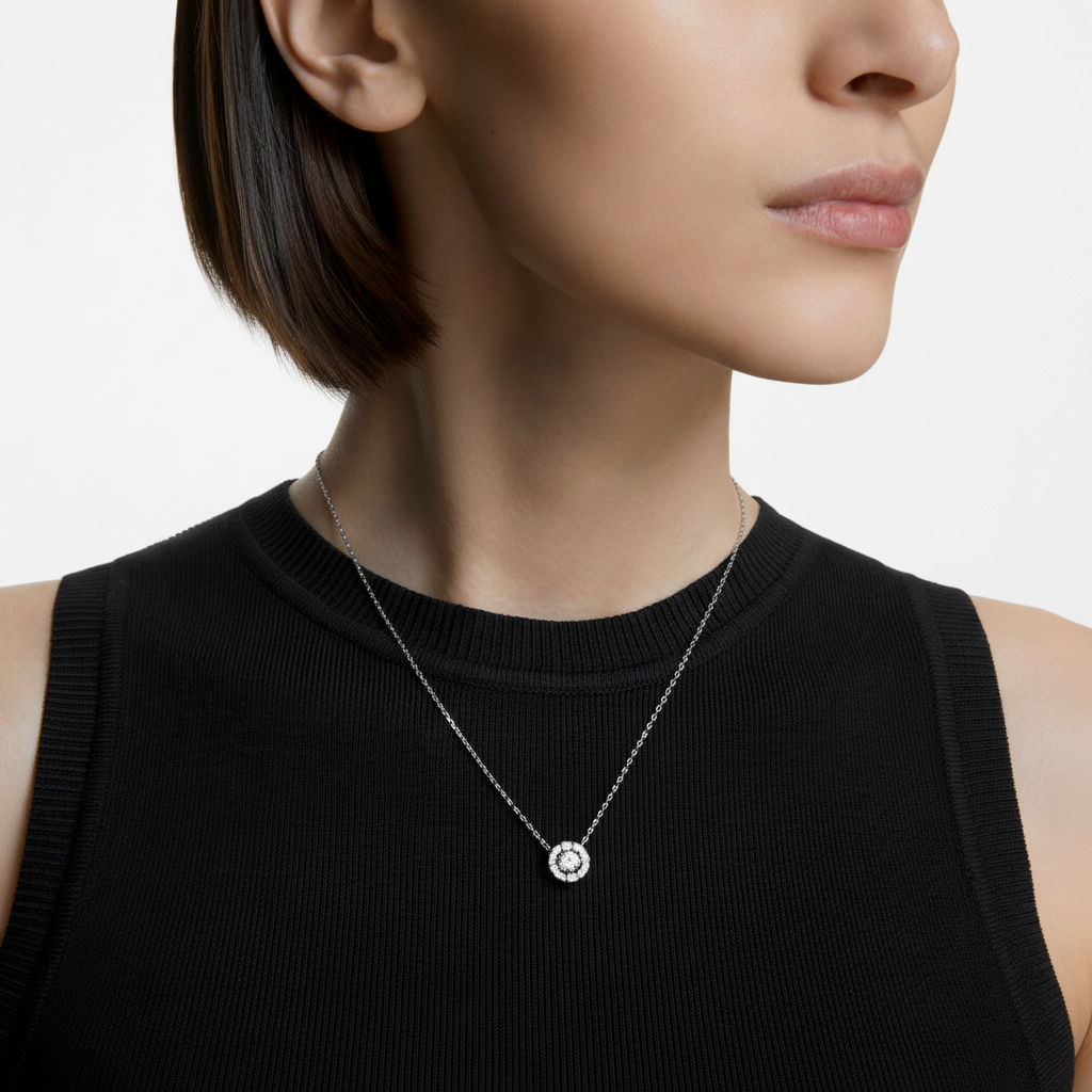 Swarovski Una necklace featuring a round-cut white crystal pendant on a rhodium-plated chain.
