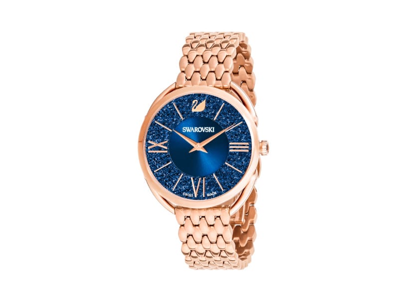 Swarovski Crystalline Glam watch with blue face and rose-gold tone PVD metal bracelet, elegant and sparkling jewelry accessory.