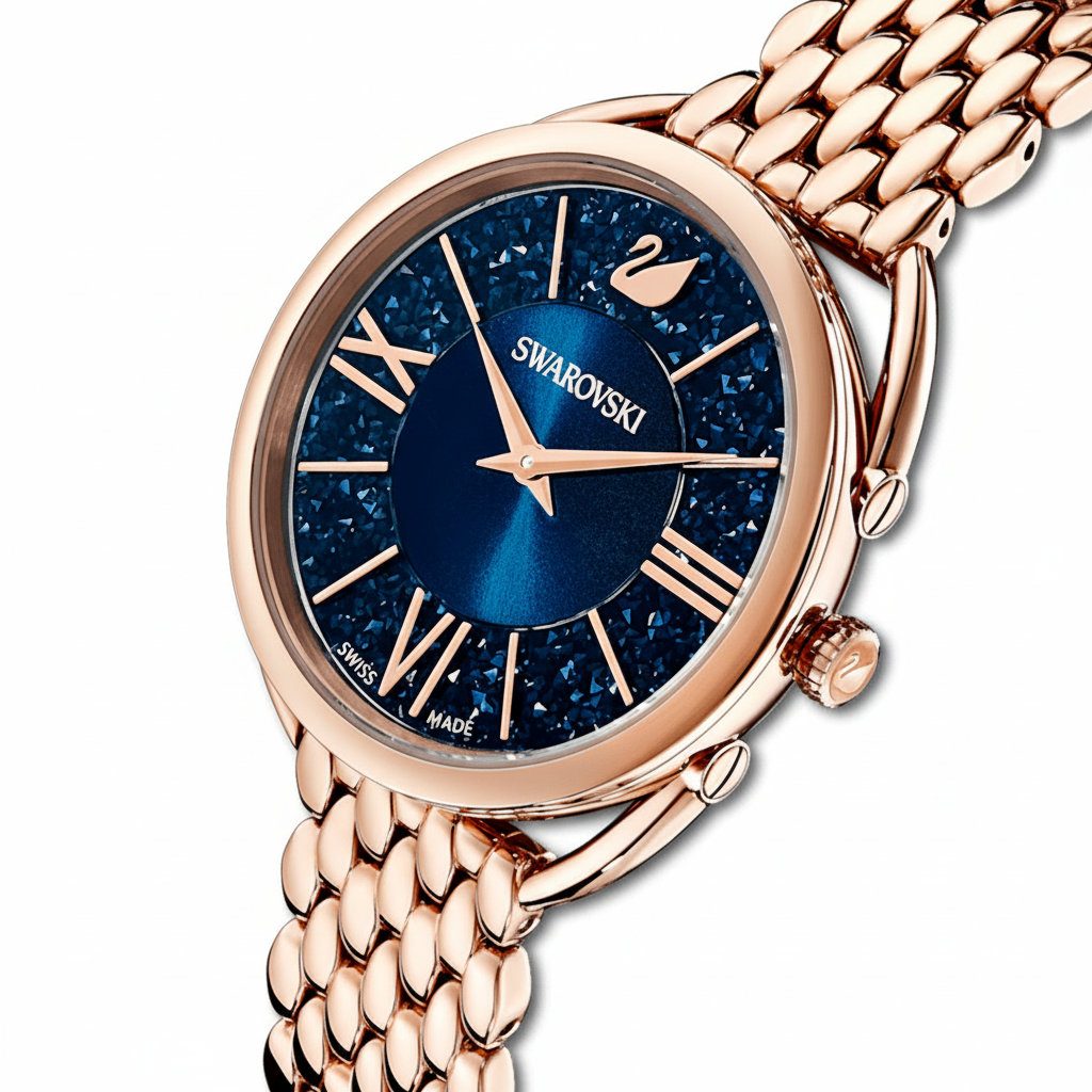 Swarovski Crystalline Glam watch with blue dial, rose-gold PVD metal bracelet, and sparkling crystal accents.