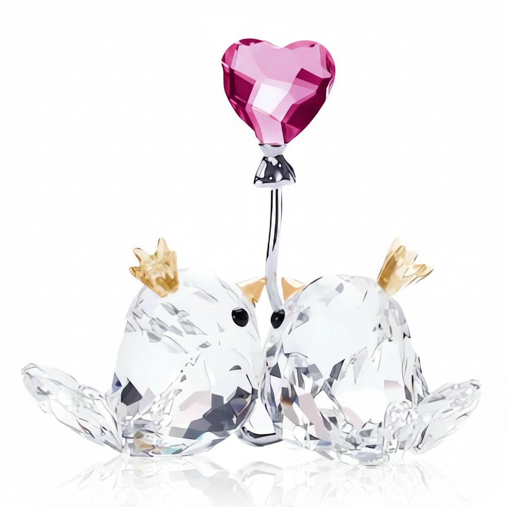 Swarovski Love Birds figurine with pink heart, sparkling crystal details, featuring two lovebirds perched together in a delicate design.