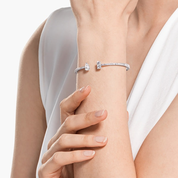 Swarovski Attract Cuff featuring mixed-cut clear crystals and silver-tone metal, stylish jewelry accessory.