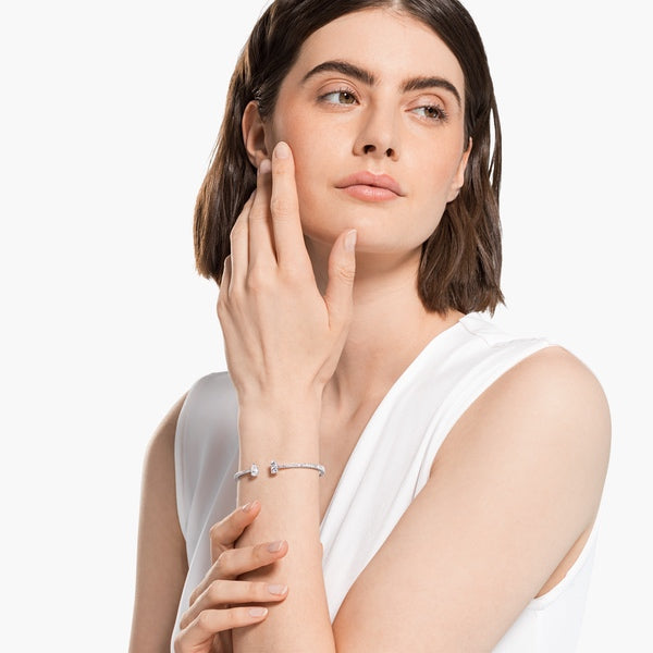 Swarovski Attract Cuff featuring mixed cut crystals in silver-tone metal, showcasing elegant, sparkling jewelry design.