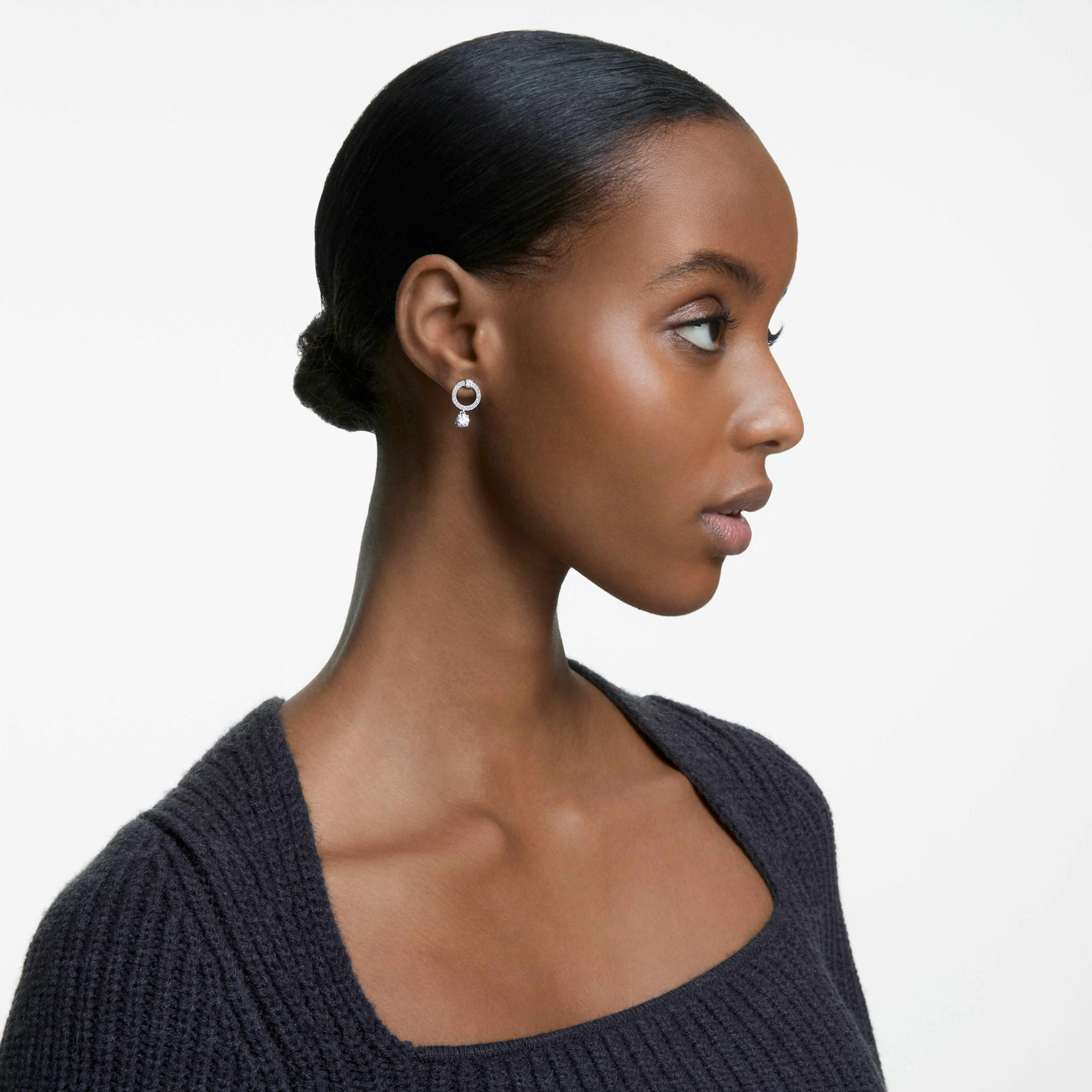 Swarovski Attract Hoop Earrings with round white crystals and rhodium plating, elegant jewelry accessory for women.