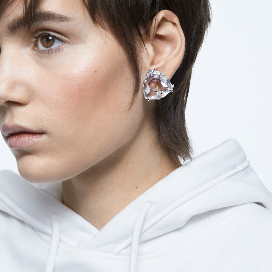 Single Swarovski Mesmera clip earring with triangle cut white crystal and rhodium plating, elegant jewelry accessory.