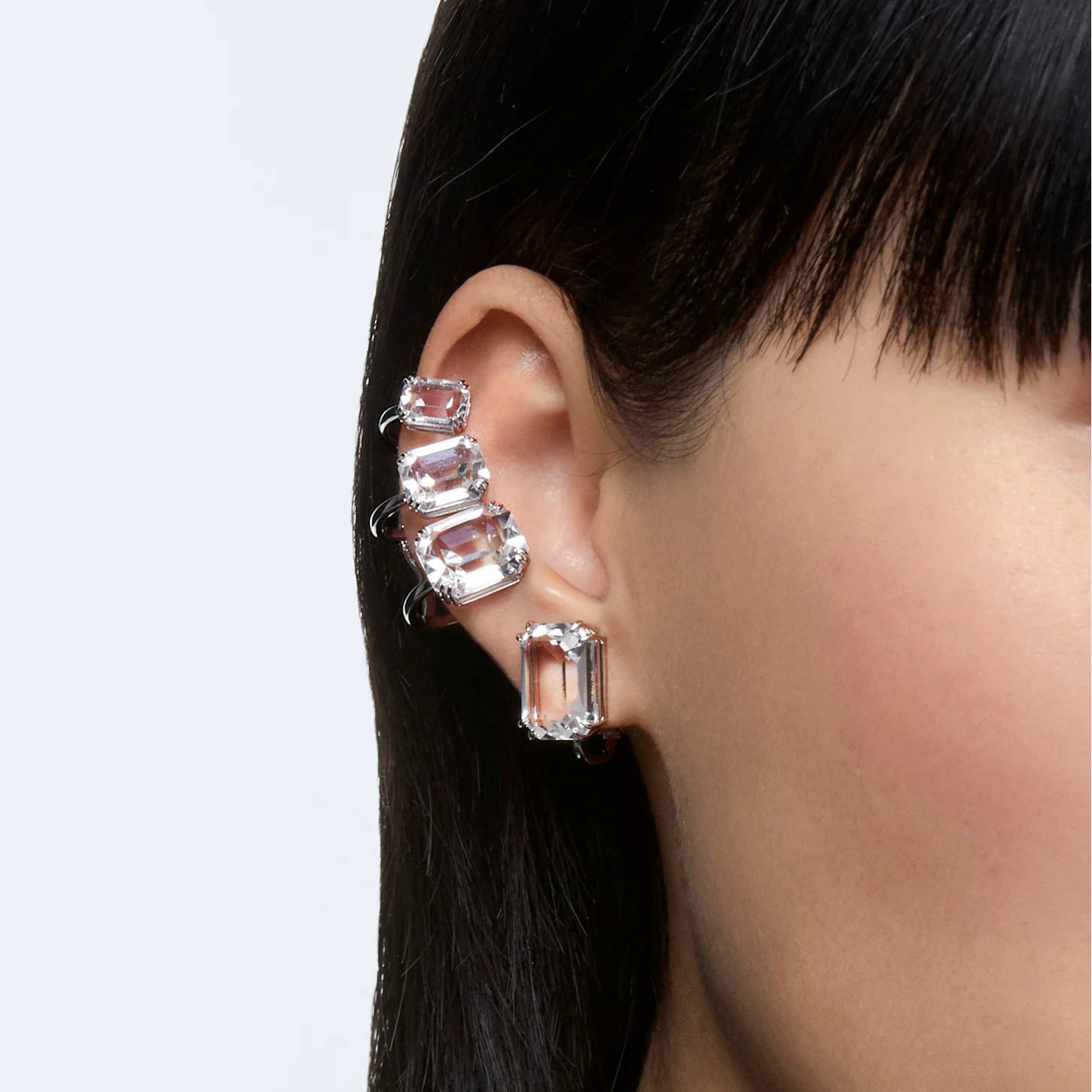 Swarovski Mesmera clip earring with an octagon-shaped clear crystal, white rhodium plating, and elegant design.