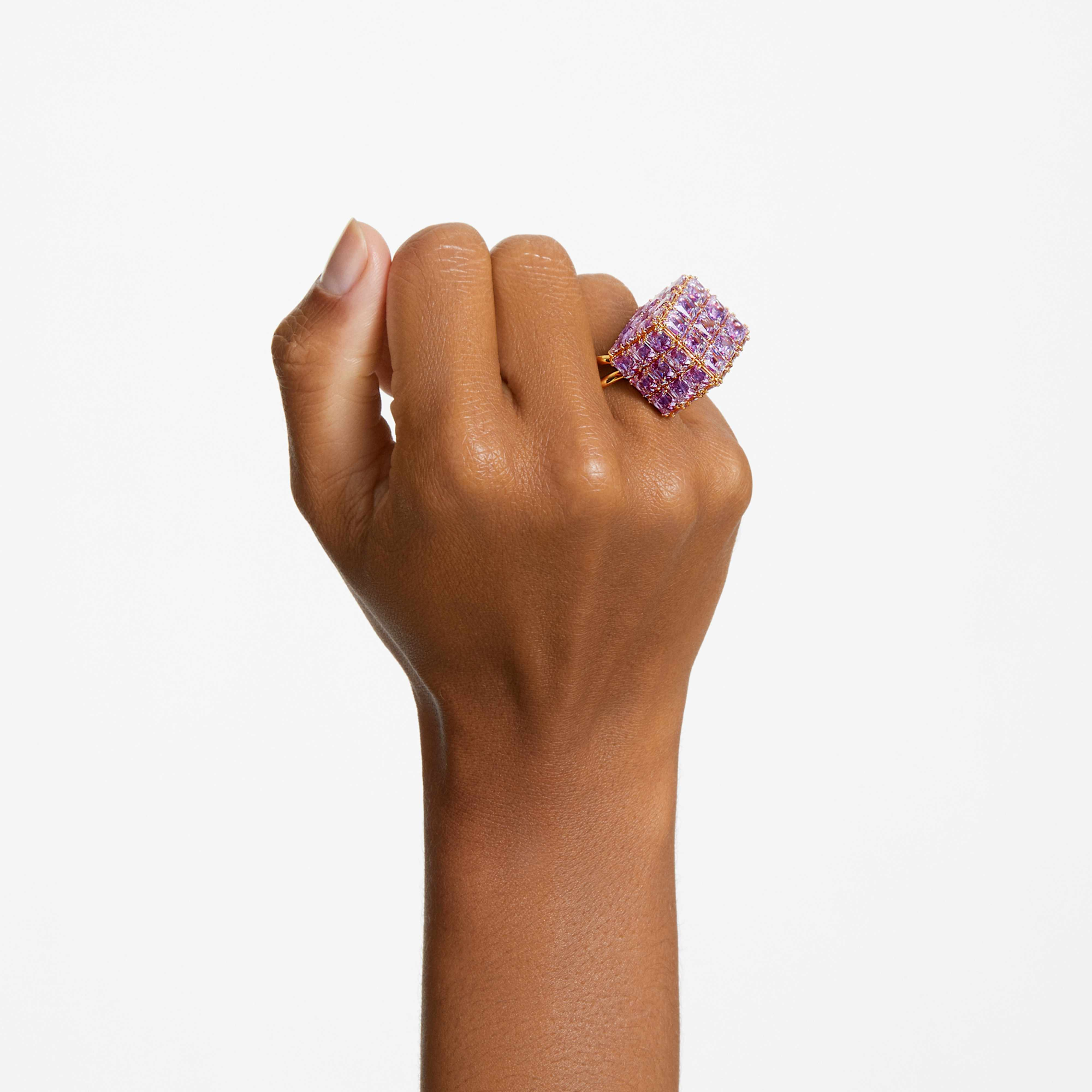 Swarovski Curiosa cocktail ring with a square-cut purple gemstone and gold-tone plated band, elegant jewelry accessory.