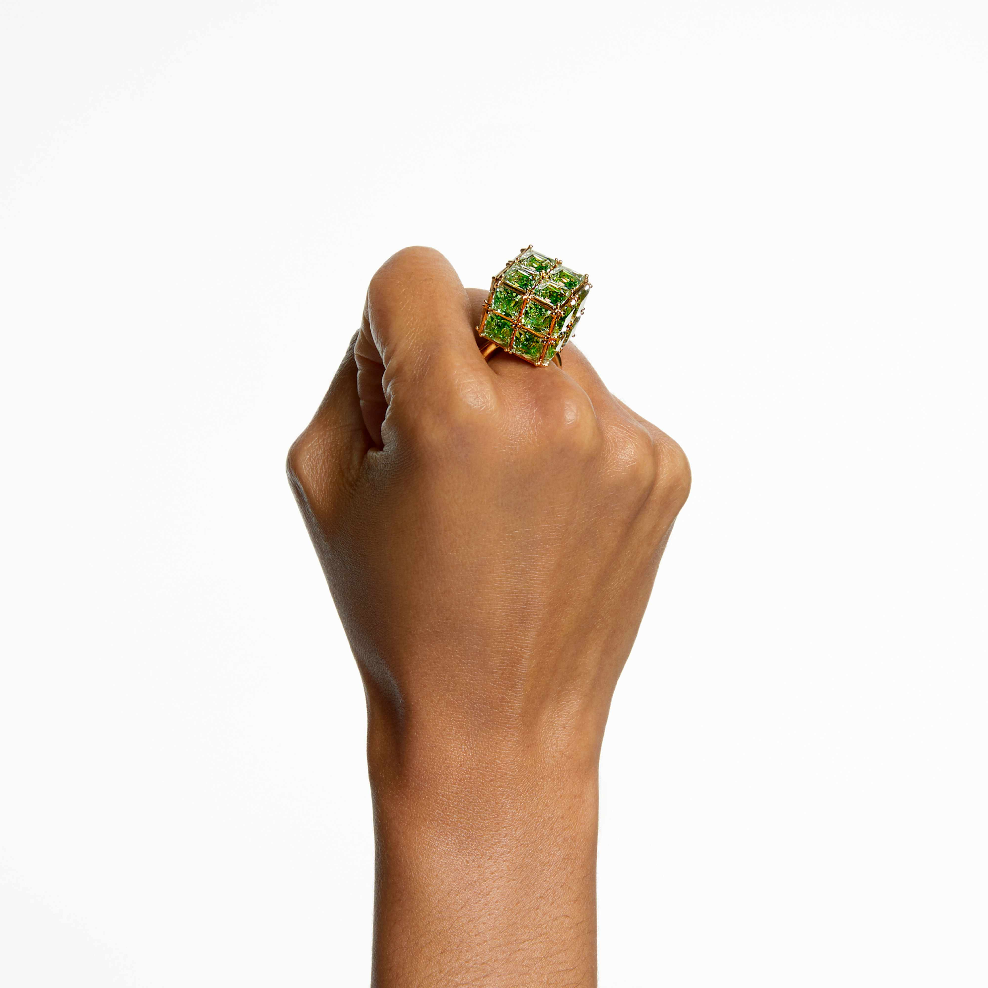 Swarovski Curiosa cocktail ring with a square-cut green gemstone and gold-tone plated band, showcasing elegant jewelry design