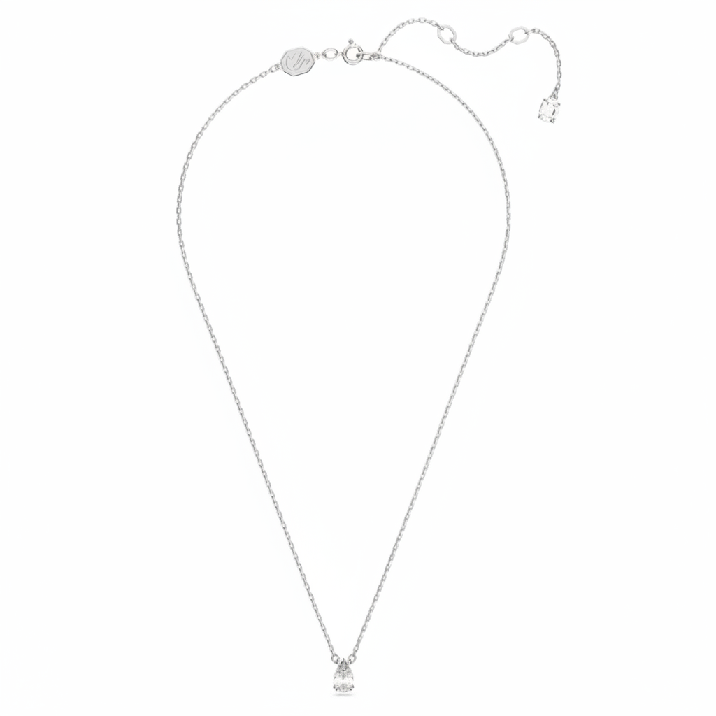Swarovski Stilla pendant with pear-shaped white crystal, rhodium-plated setting, elegant jewelry piece.