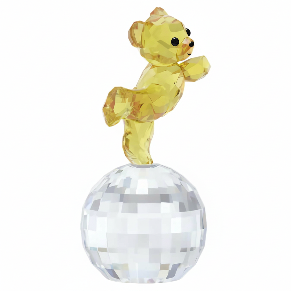 Swarovski Kris Bear figurine with disco ball and colorful accessories, showcasing a playful design and sparkling crystal details.