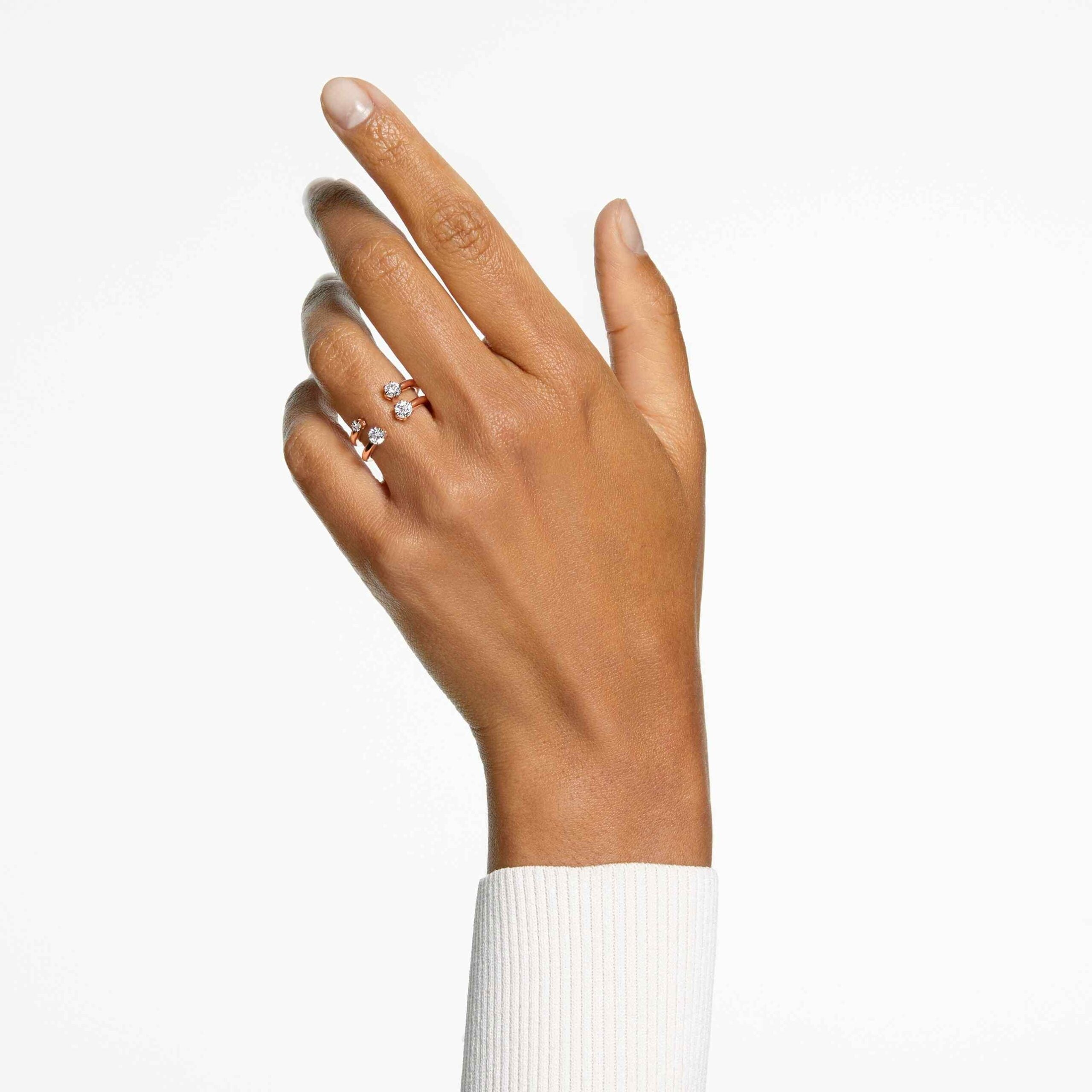 Swarovski Constella ring set with two rose-gold plated rings featuring round-cut white crystals, elegant jewelry for special occasions.