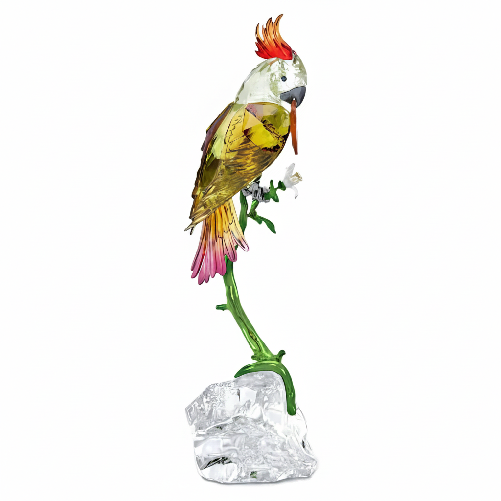 Swarovski Idyllia Cockatoo crystal figurine with detailed white and yellow feathers, elegant bird sculpture with sparkling accents.