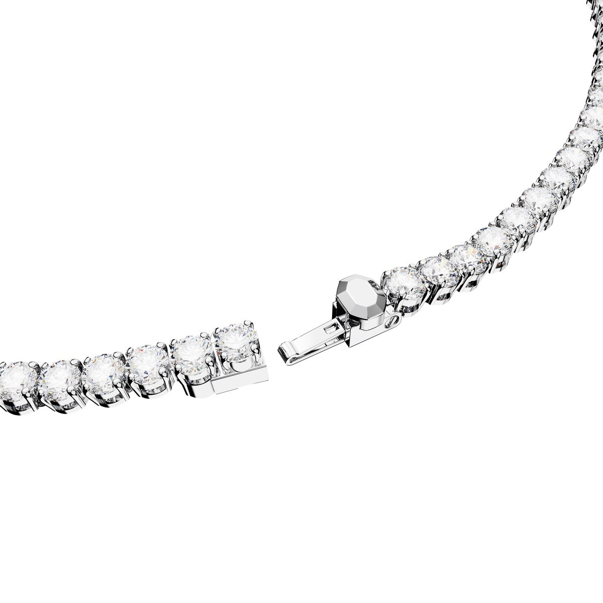Swarovski Matrix Tennis Set featuring round-cut white gemstones with rhodium plating, elegant jewelry design.