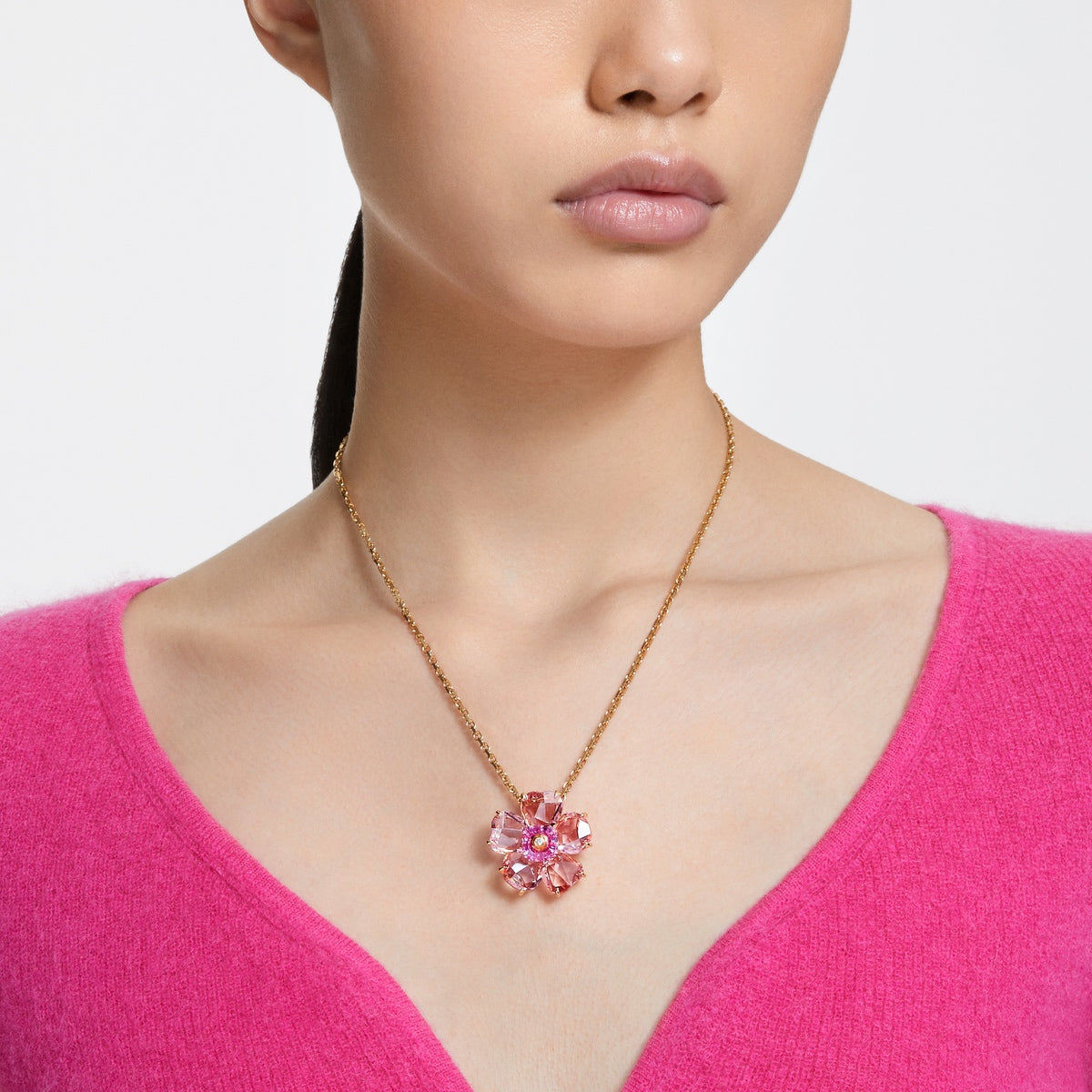 Swarovski Idyllia Pink Flower Necklace with gold-tone plating, featuring intricate flower design and sparkling crystals.