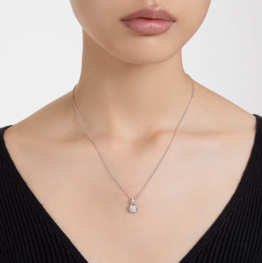 Swarovski April birthstone pendant with square-cut white crystal, rhodium-plated silver setting, elegant jewelry piece.