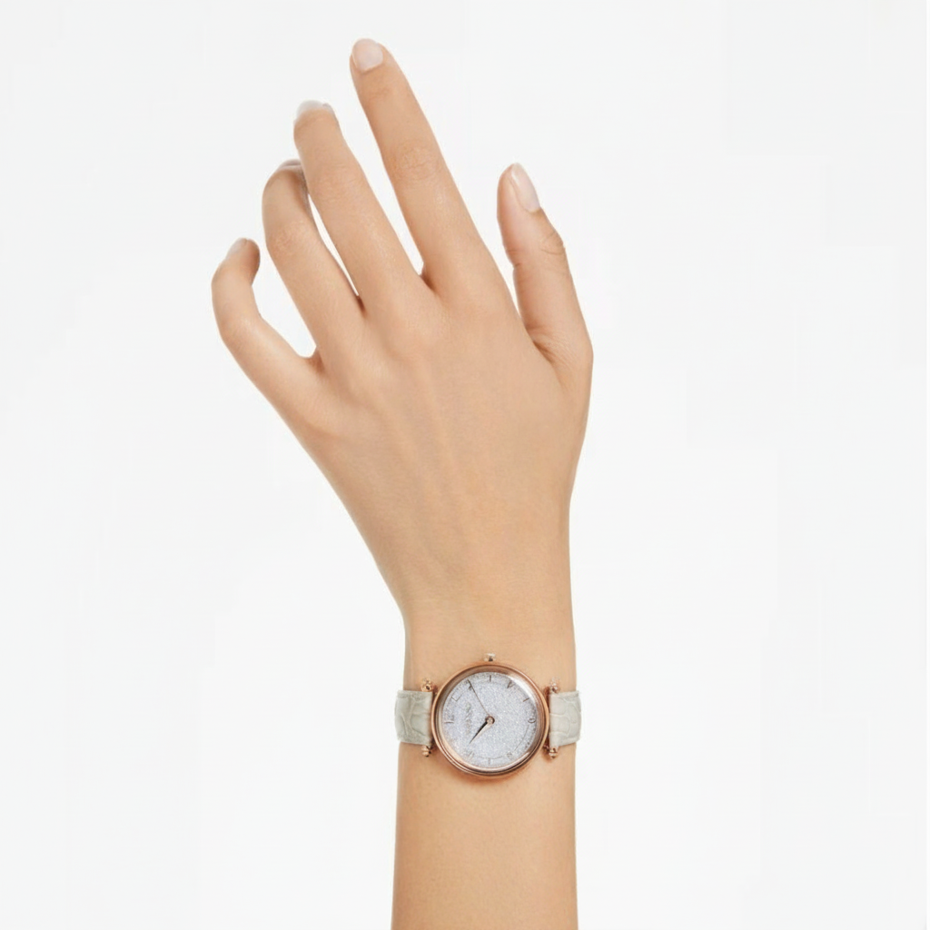 Swarovski Crystalline Wonder Swiss Made watch with beige leather strap and rose gold-tone finish, featuring sparkling crystal accents.
