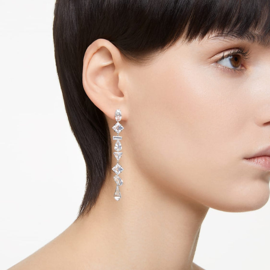 Swarovski Mesmera drop earrings with asymmetrical design, mixed cuts, long shape, white rhodium plating, elegant jewelry accessory