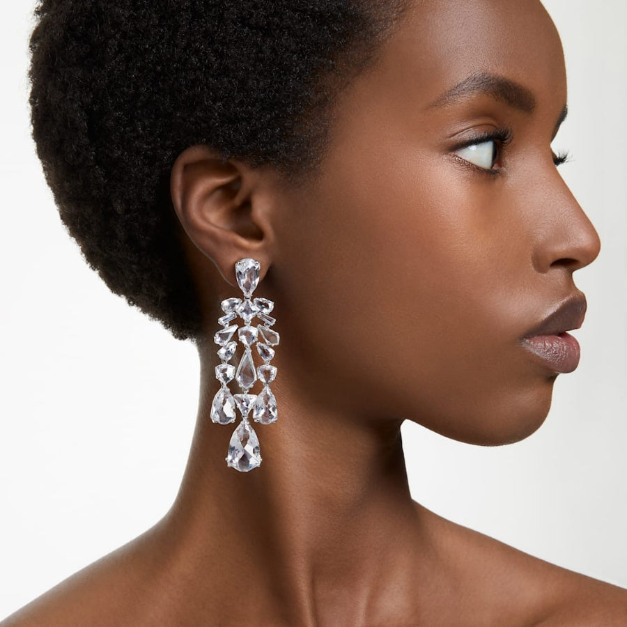 Swarovski Mesmera clip earrings with mixed cuts, chandelier style, white crystals, rhodium-plated finish.