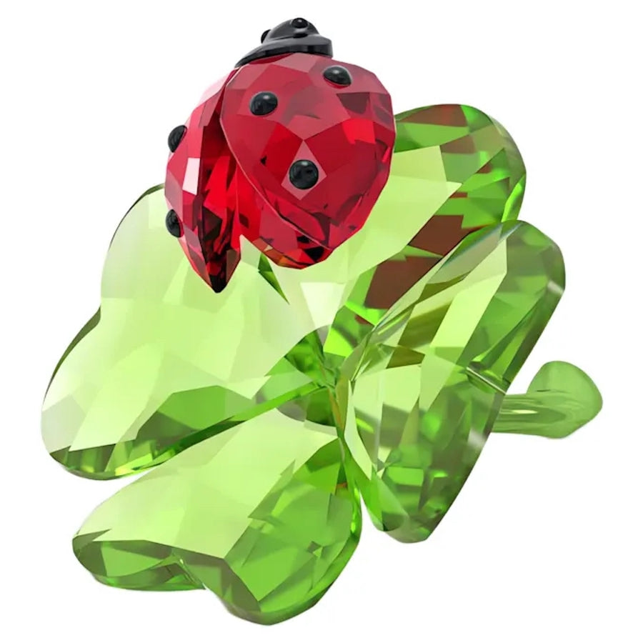 Swarovski Idyllia Ladybug and Clover figurine featuring sparkling crystal ladybug and clover design on a clear base.