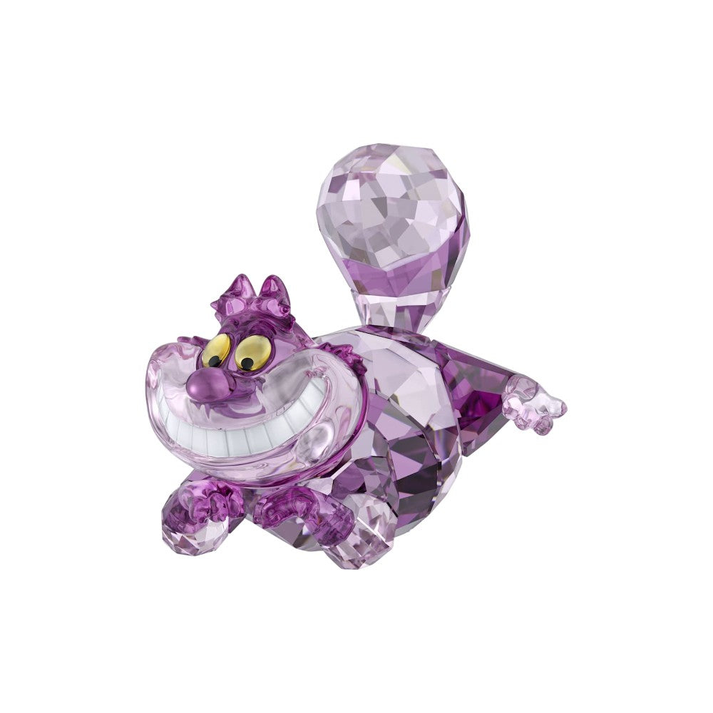 Swarovski Alice In Wonderland Cheshire Cat figurine with pink and purple crystal details, showcasing a mischievous grinning cat.