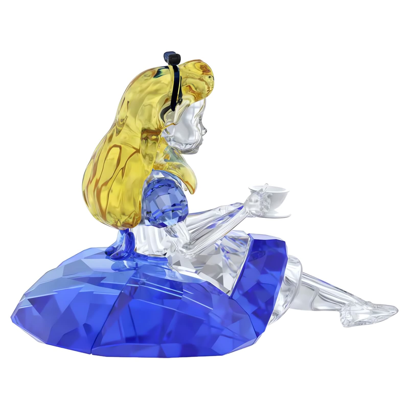 Swarovski Alice in Wonderland Alice figurine with detailed crystal craftsmanship, featuring Alice in a blue dress and blonde hair.