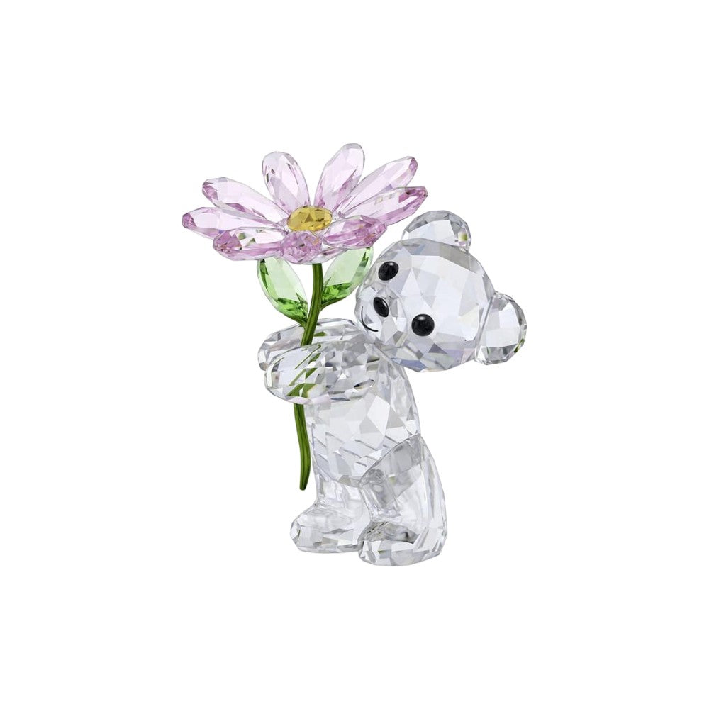 Swarovski Kris Bear holding a daisy, detailed crystal figurine with a cute bear design and floral accessory.