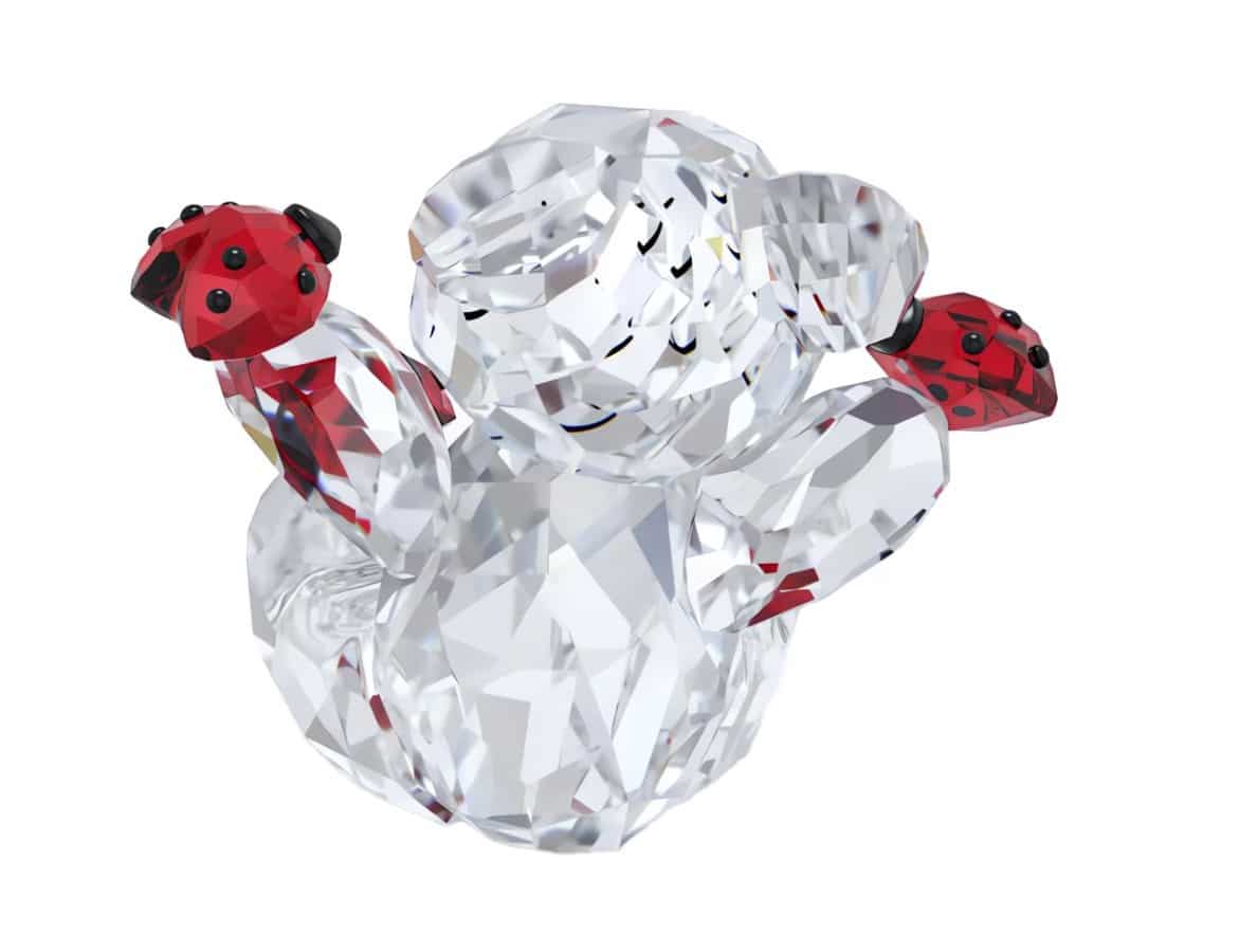 Swarovski Kris Bear Good Luck Bear figurine with clear crystal details and a cheerful expression, crafted by Swarovski.