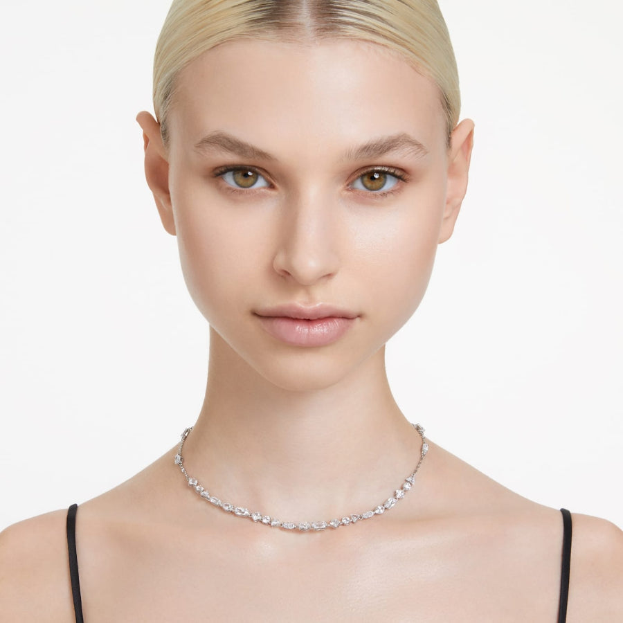 Swarovski Mesmera necklace with scattered mixed cut crystals, white rhodium plating, elegant jewelry design.