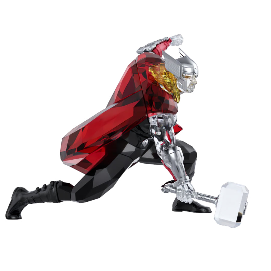 Swarovski Marvel Thor crystal figurine featuring Thor with hammer and flowing cape, detailed and sparkling in clear and metallic tones.