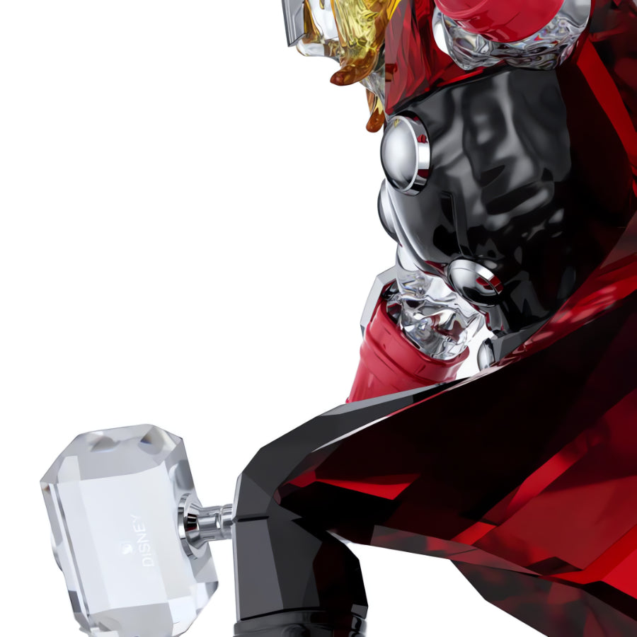 Swarovski Marvel Thor figurine with detailed crystal sculpture of Thor wielding his hammer, featuring sparkling clear and colored crystals.