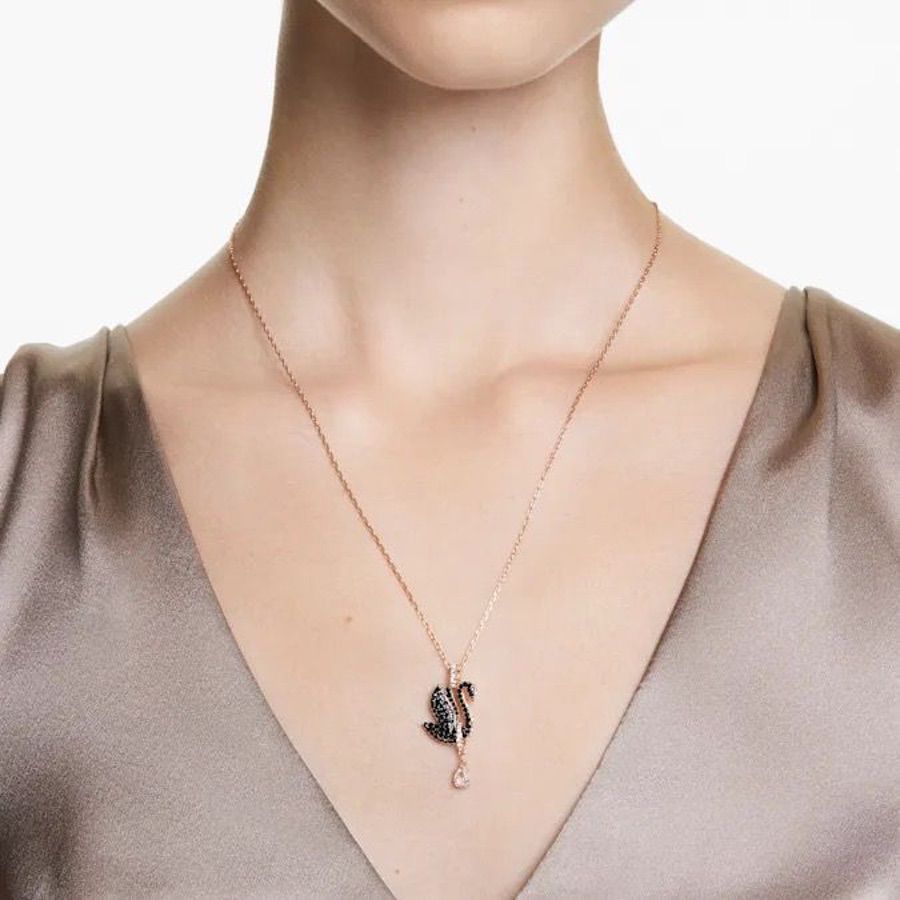 Swarovski Swan Pendant in black and rose gold-tone plated metal with a detailed swan design and sparkling crystal accents.