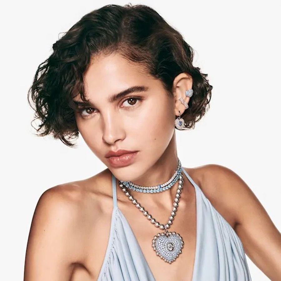 Swarovski Hyperbola Drop Earrings with heart-shaped blue crystals and rhodium-plated setting, elegant jewelry for special occasions.