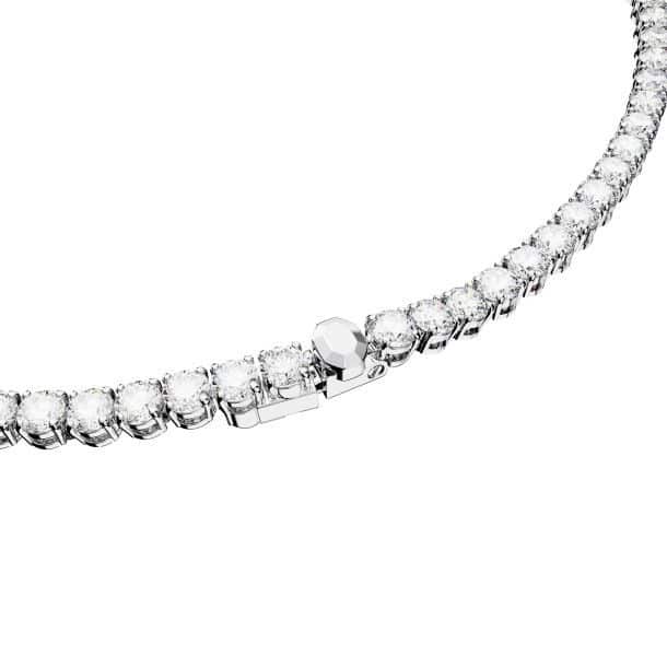 Swarovski Matrix tennis necklace with round-cut white crystals, rhodium-plated, elegant jewelry piece on a display.