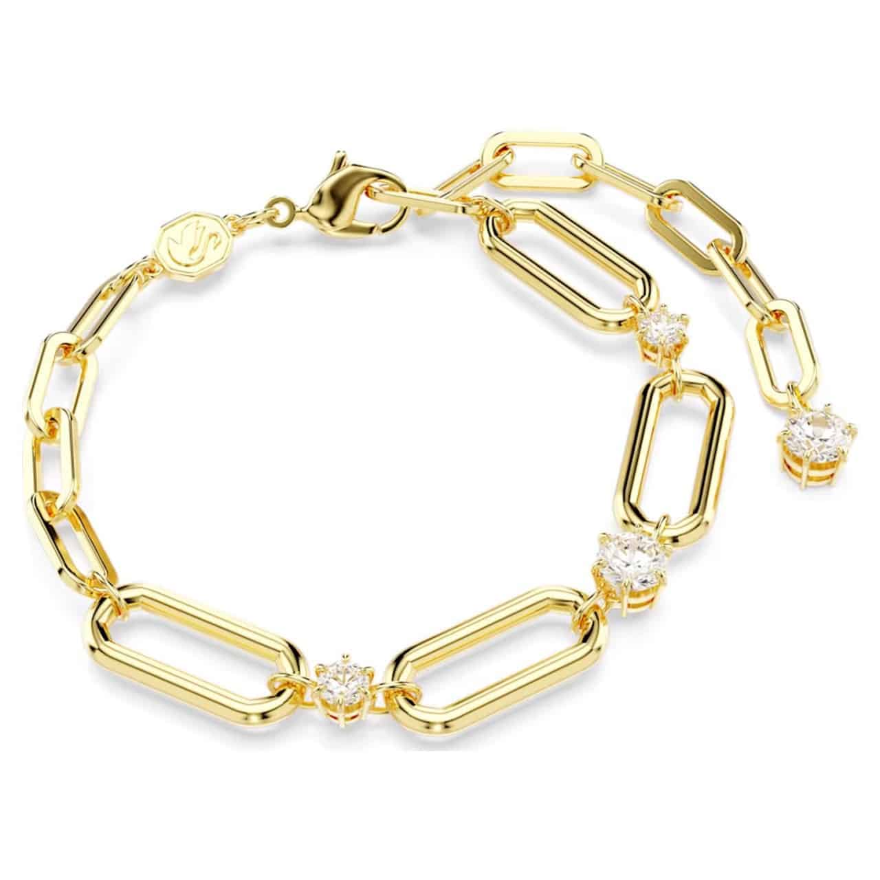 Swarovski Constella bracelet with white stones and gold-tone plating, featuring a delicate, elegant design.
