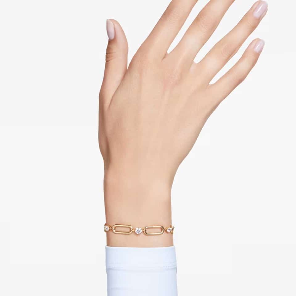 Swarovski Constella bracelet in white with gold-tone plating, featuring sparkling crystal accents on a delicate chain.