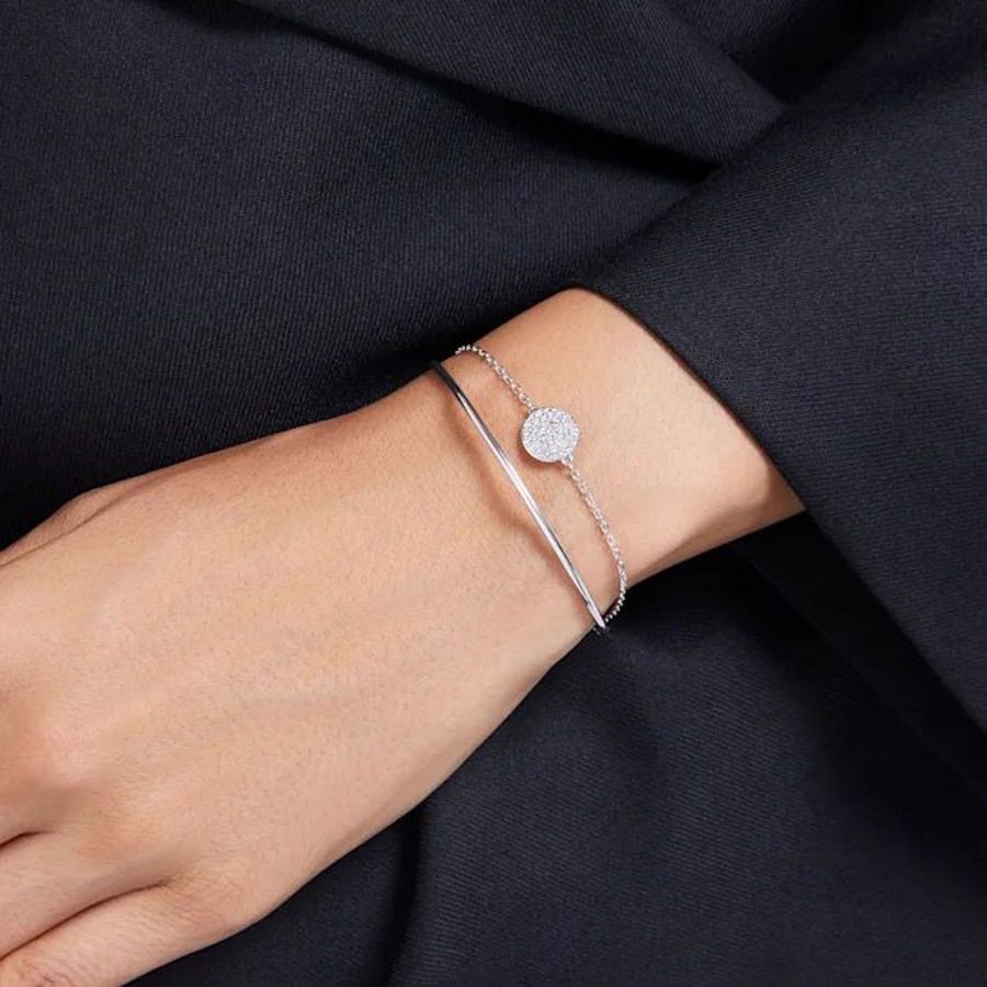 Swarovski Meteora Bangle in white rhodium plating with sparkling crystal accents, elegant jewelry accessory for women.
