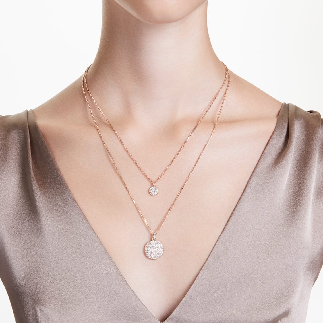 Swarovski Meteora layered pendant with white rose gold-tone plating, featuring sparkling crystal designs and intricate metal detailing.
