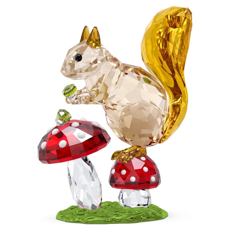 Swarovski Idyllia squirrel figurine with mushrooms, crafted with sparkling crystal details, showcasing intricate design and craftsmanship.