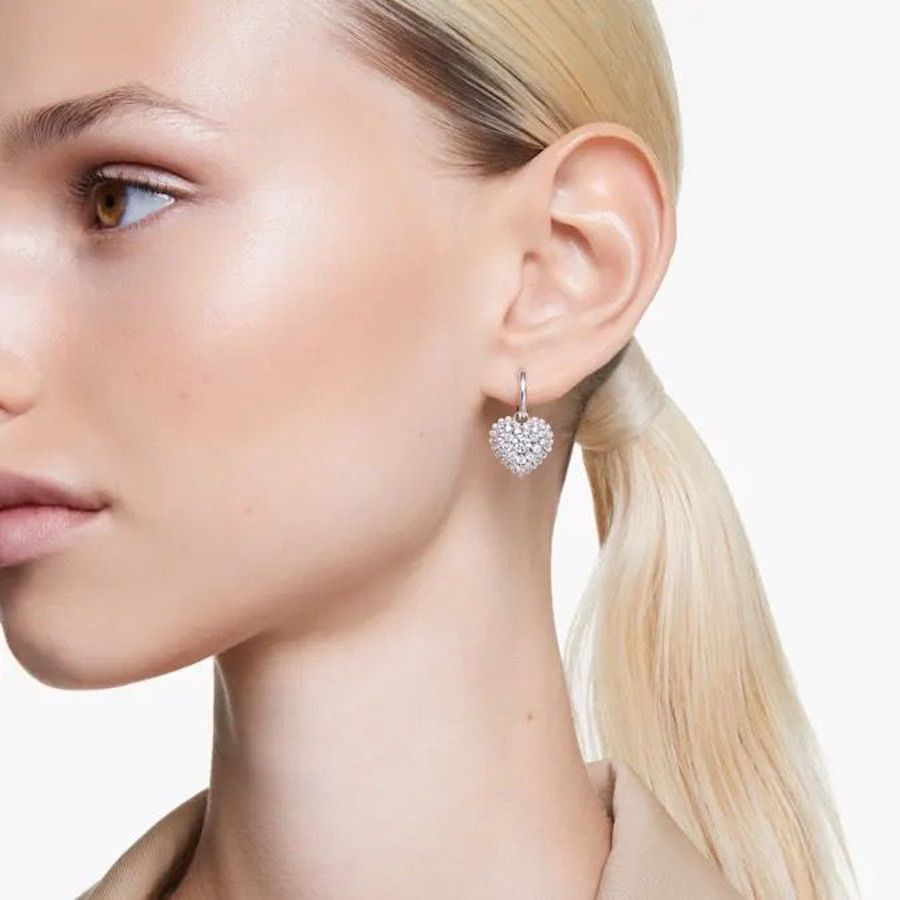 Swarovski Hyperbola Drop Earrings with heart design, white rhinestones, and rhodium plating on elegant jewelry image
