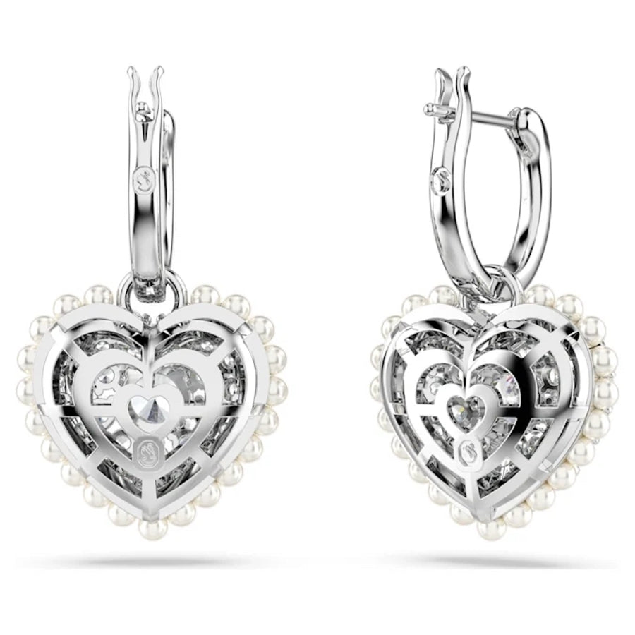 Swarovski Hyperbola Drop Earrings with heart-shaped white crystals, rhodium plated, featuring elegant and sparkling jewelry design.