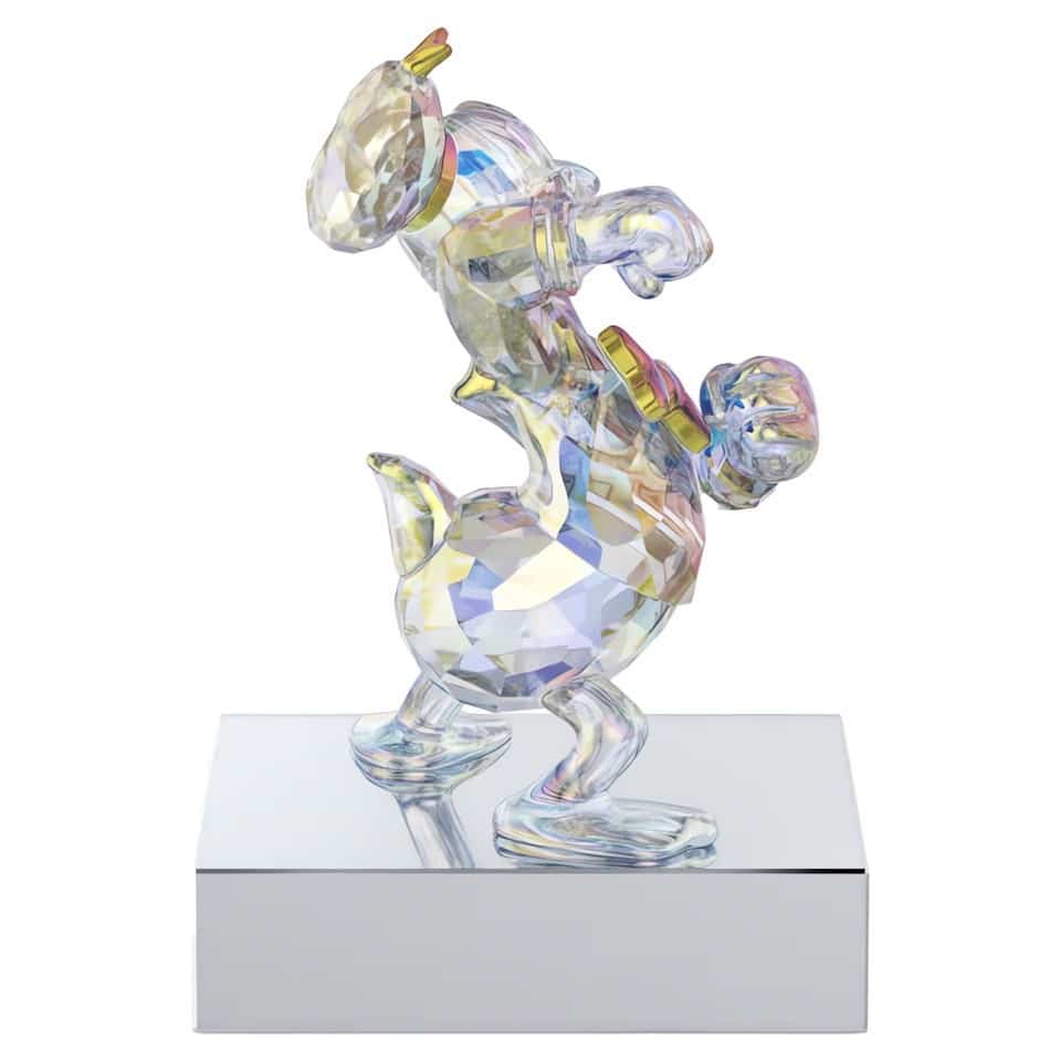 Swarovski Mickey & Friends Donald Disney character figurine with sparkling crystal details on a clear display stand.