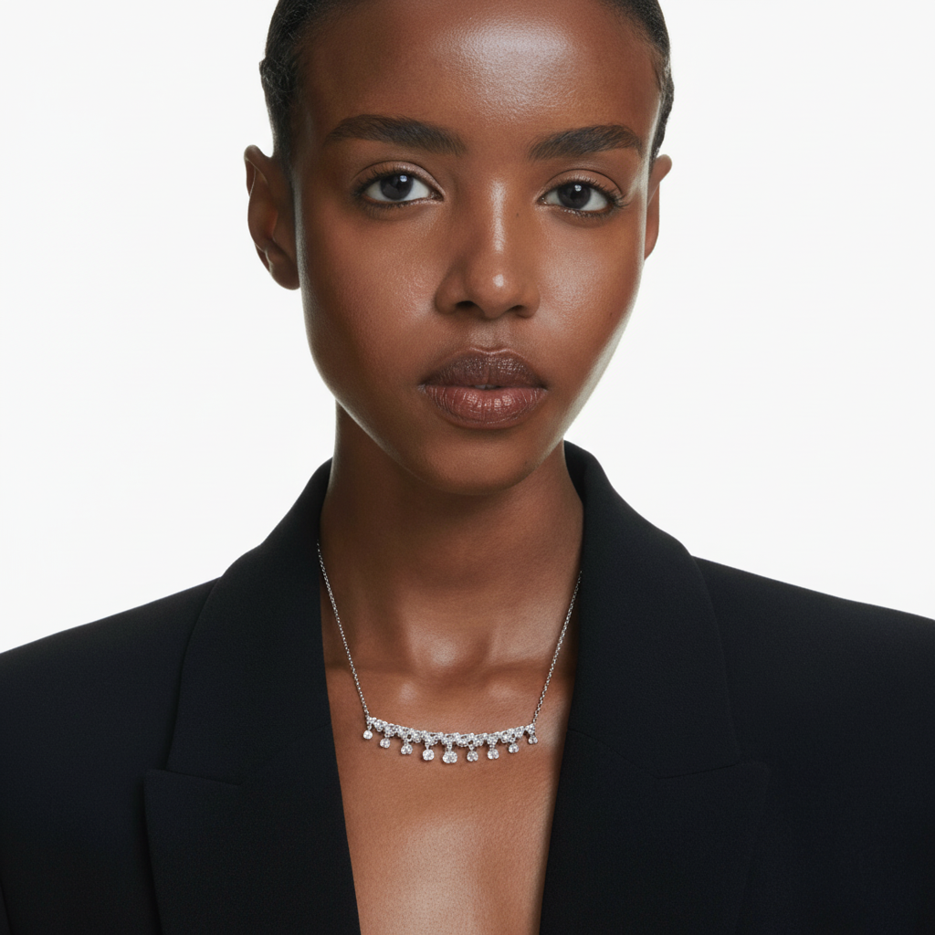 Swarovski Idyllia necklace with mixed cut snowflake-shaped white crystals, rhodium-plated chain and pendant.