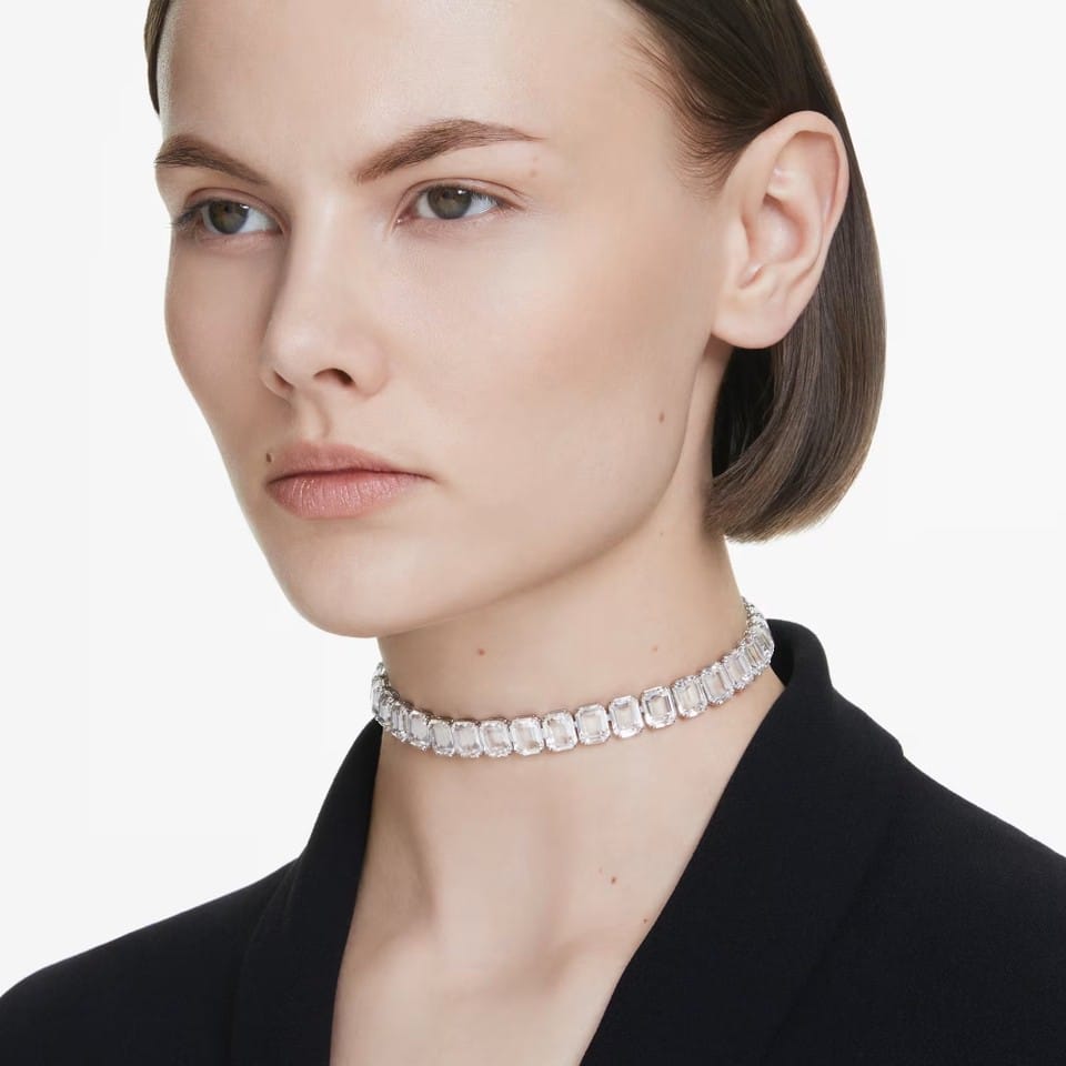 Swarovski Millenia crew neck necklace with white octagonal cut crystals, rhodium-plated, featuring elegant jewelry design.