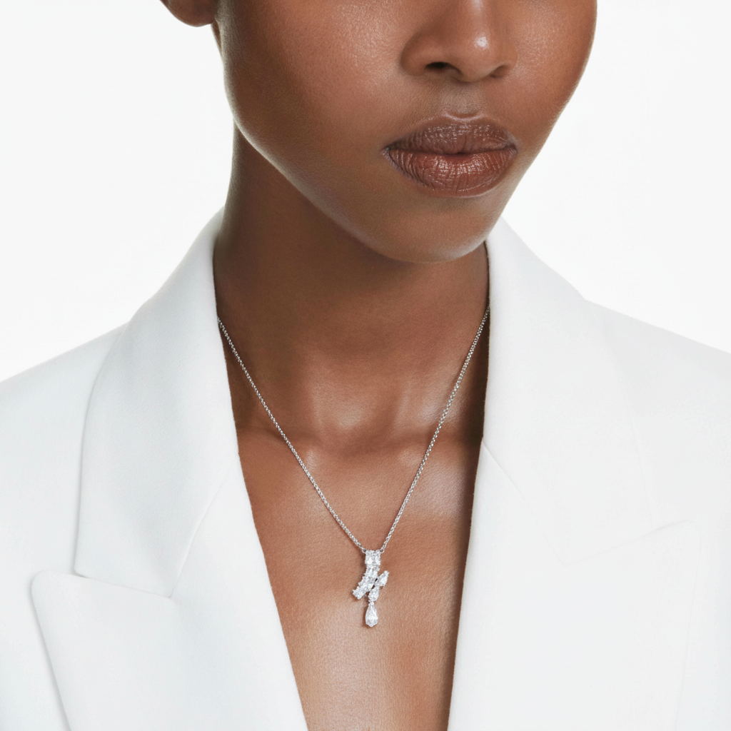 Swarovski Matrix pendant with mixed cut white crystals in rhodium-plated setting, showcasing intricate jewelry design.