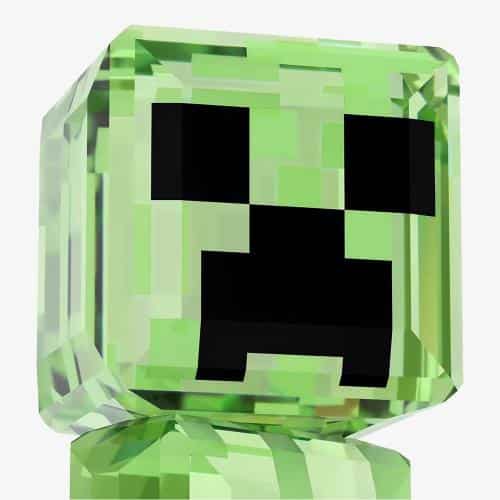 Swarovski Minecraft Creeper crystal figurine with green and black faceted crystals on a clear base.