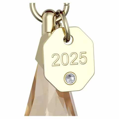 Swarovski Annual Edition Festive Ornament 2025 with intricate crystal design and silver accents, hanging from a festive ribbon.