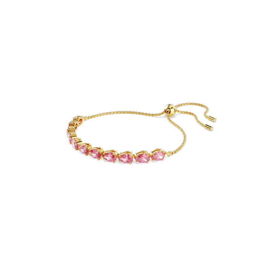 Swarovski Matrix bracelet with pink pear-cut crystals and gold-tone plating, featuring a sleek, modern design.